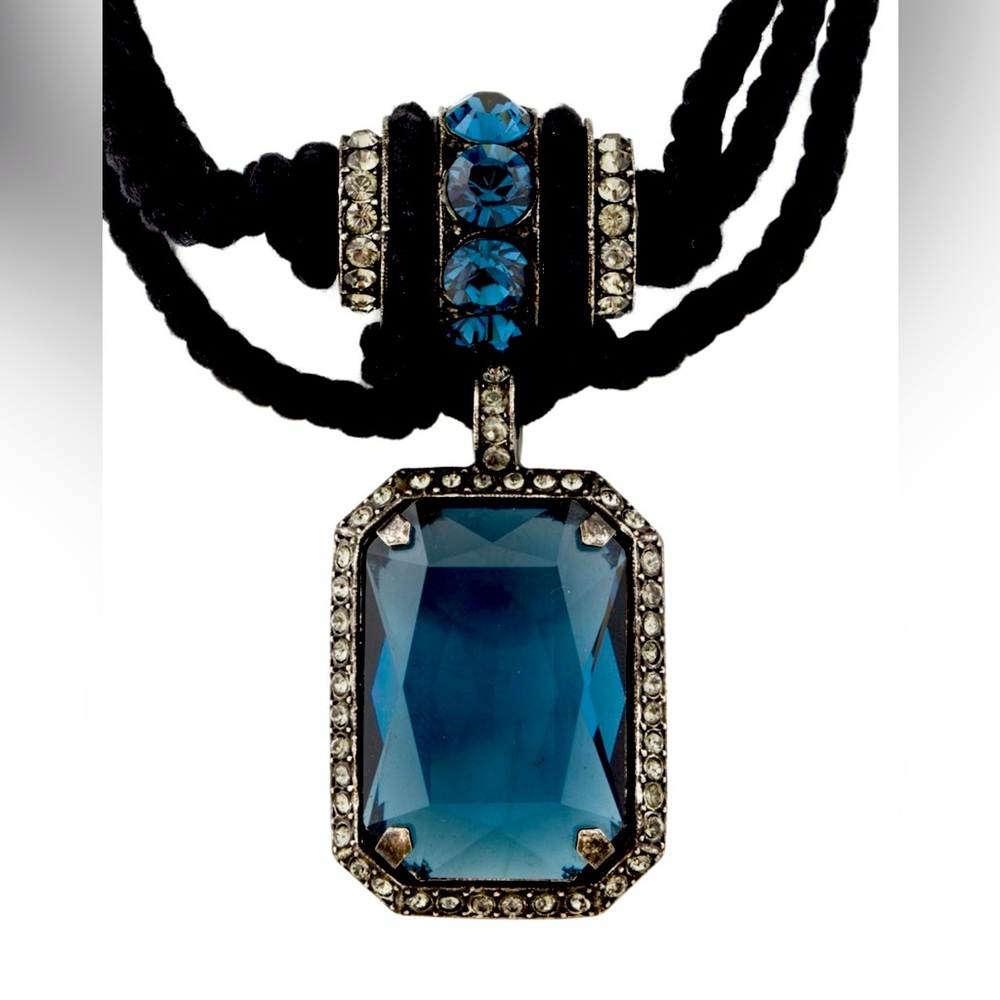 Stunning blue crystal pendant statement necklace. Silver tone metal. Cord chain